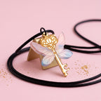 Collar o Pin Llave Alada